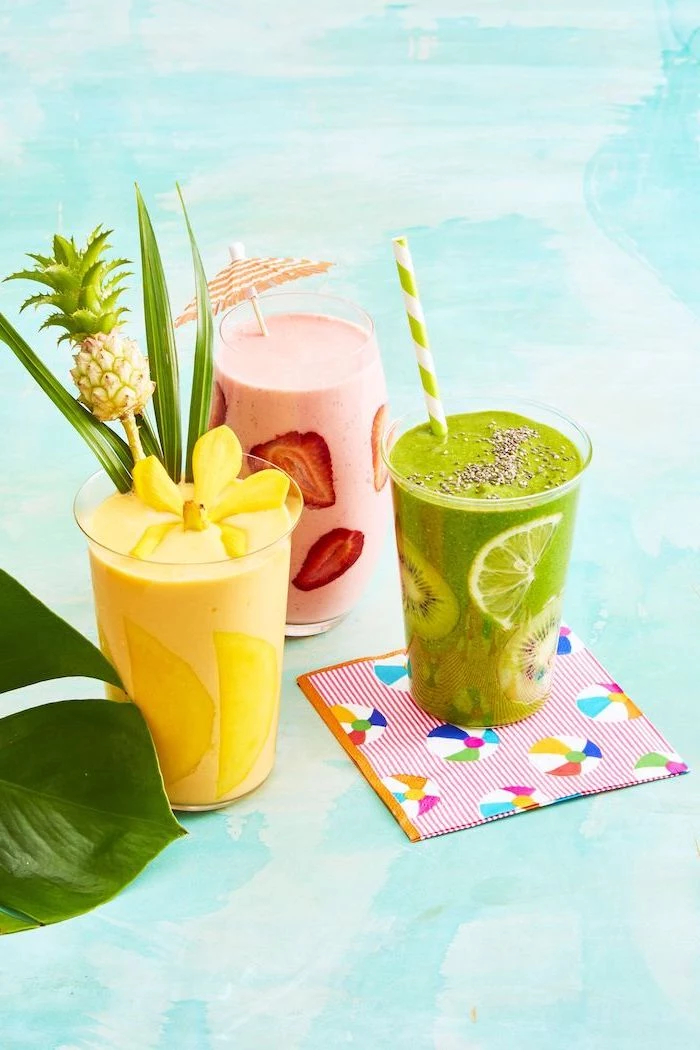 yellow smoothie with mango, green smoothie with kiwi, pink smoothie with strawberries, smoothie recipes