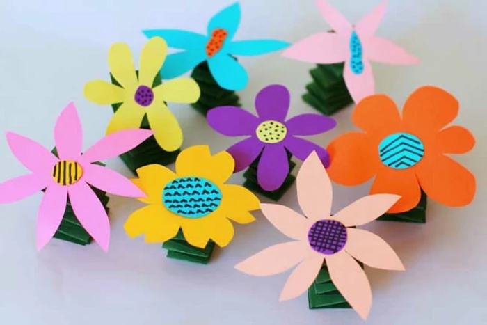 colourful flowers, made of paper, literacy activities for preschoolers, orange and yellow, purple and blue