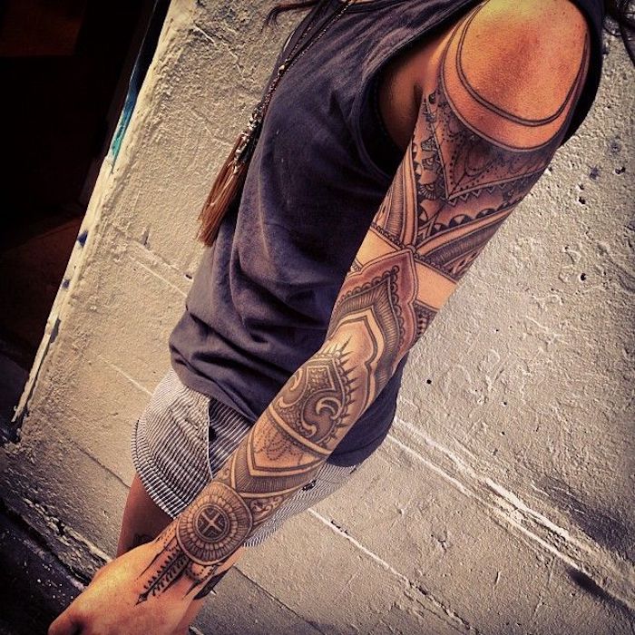 mandala arm sleeve tattoo, back tattoos for women, white and grey striped shorts, grey top