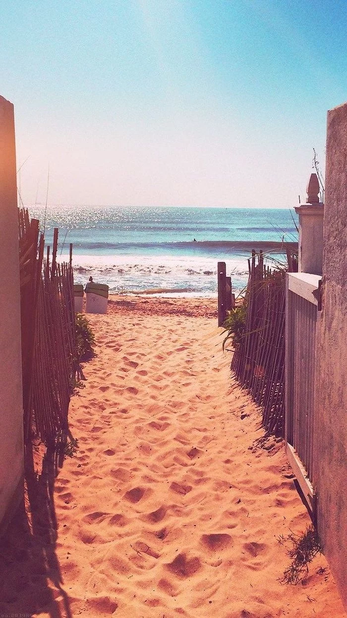 beach front, ocean waves, beach sand, cute phone wallpapers, pathway between wooden fences