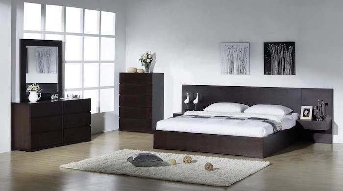 dark wooden bed frame, drawers and shelves, wooden floor, white carpet, master bedroom decorating ideas