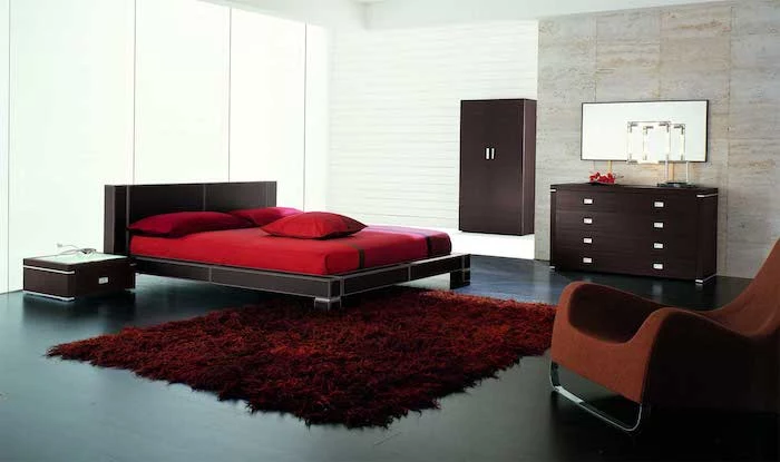 dark wooden bed frame, wardrobe and drawers, master bedroom decorating ideas, red carpet and bed linen