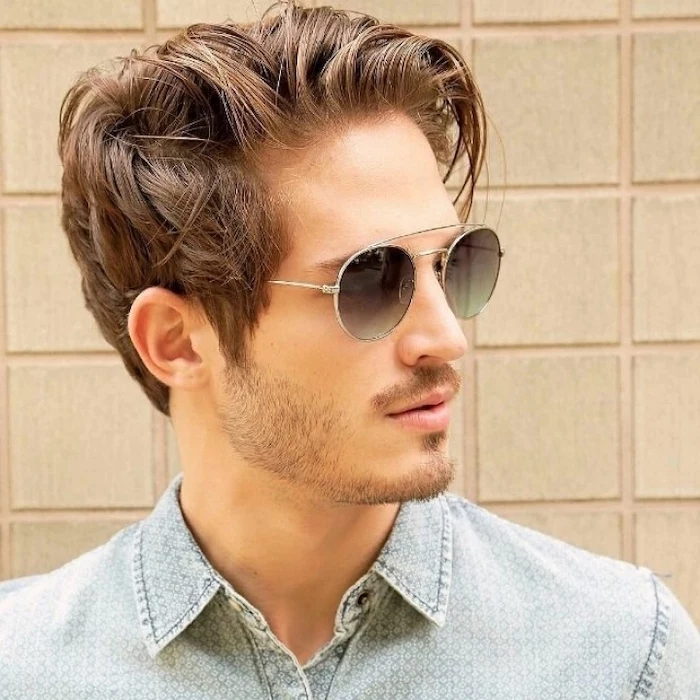 medium hairstyles for men, denim shirt, brown messy hair, man wearing sunglasses