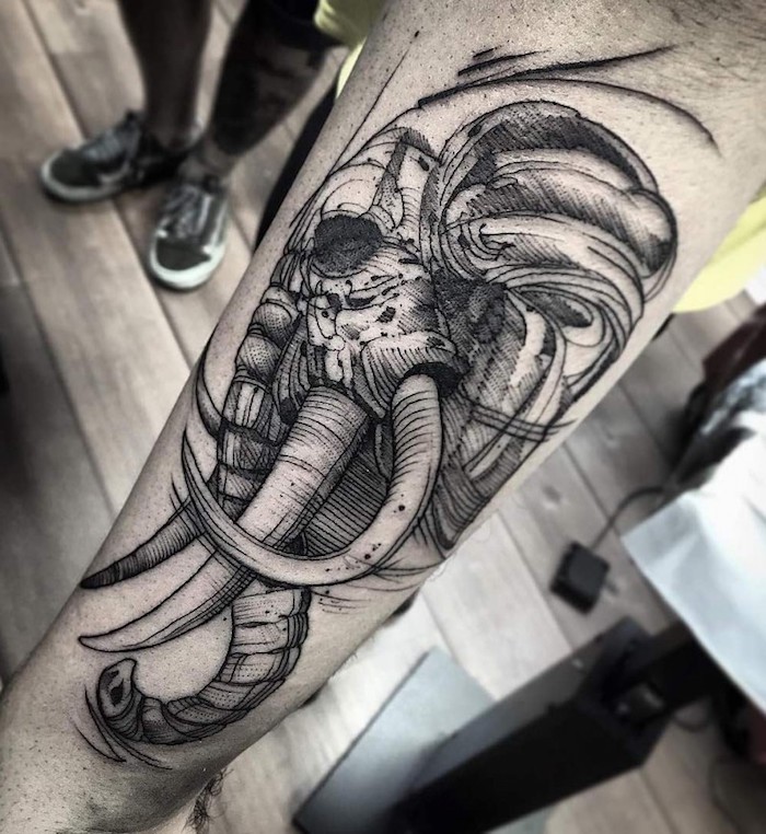 elephant skull, forearm tattoo, wooden floor, tattoo design for men