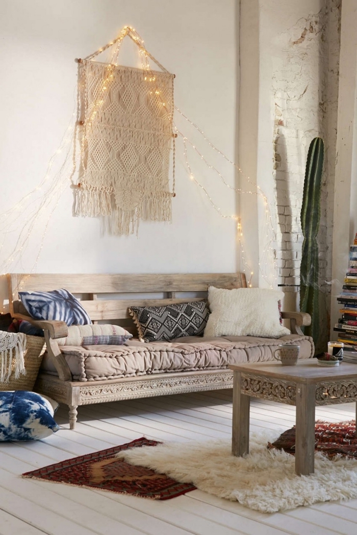 fairy lights, macrame tutorial, wooden sofa, wooden table, colourful throw pillows, white brick wall