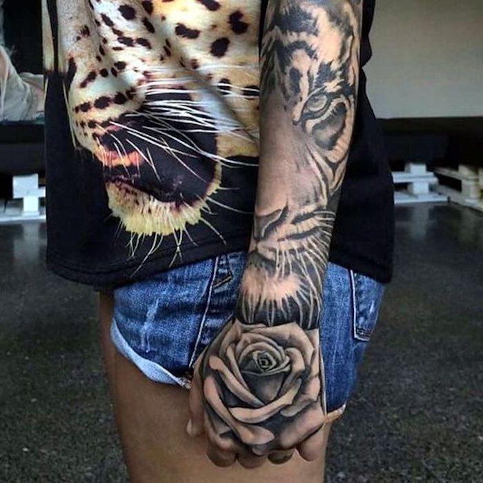 denim short, black top, side tattoos for girls, tiger head and rose, arm sleeve tattoo