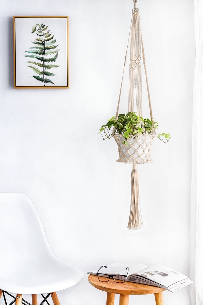 free macrame patterns and instructions, white wall, plant hanger, potted plant, white chair, open book