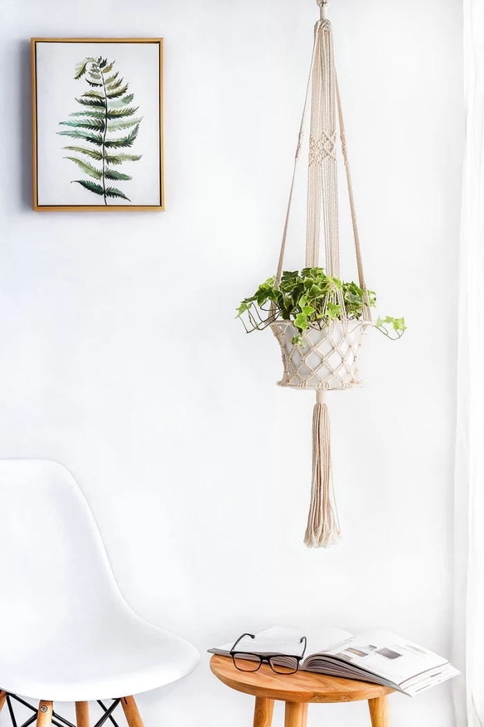 free macrame patterns and instructions, white wall, plant hanger, potted plant, white chair, open book
