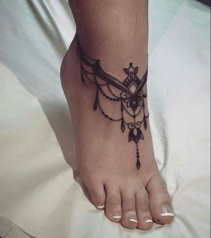 french manicure, small meaningful tattoos, mandala ankle tattoo, white cloth