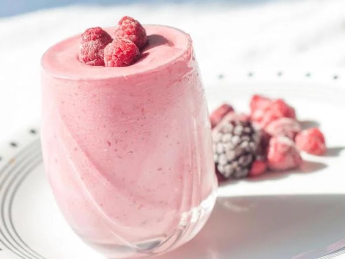 pink smoothie, easy smoothie recipes, frozen berries, on a white plate