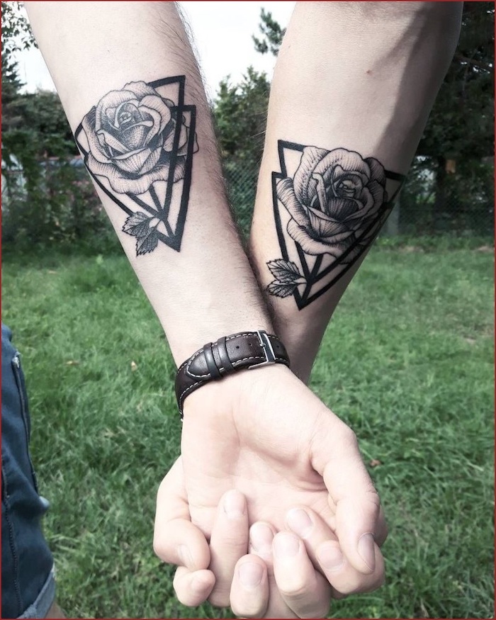 geometric roses, forearm tattoos, his and hers tattoos, holding hands, green grass field