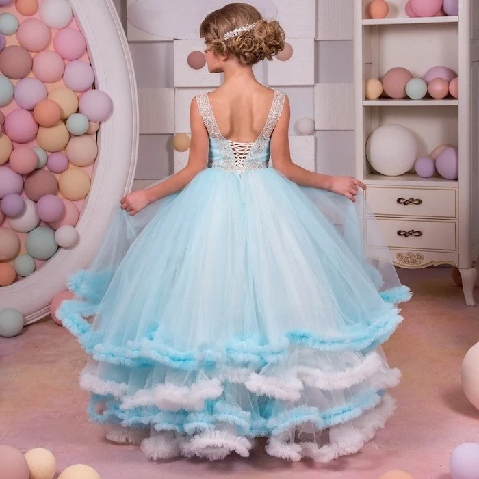 blue and white tulle dress, toddler girl dresses, blonde hair, in a low updo, colourful background
