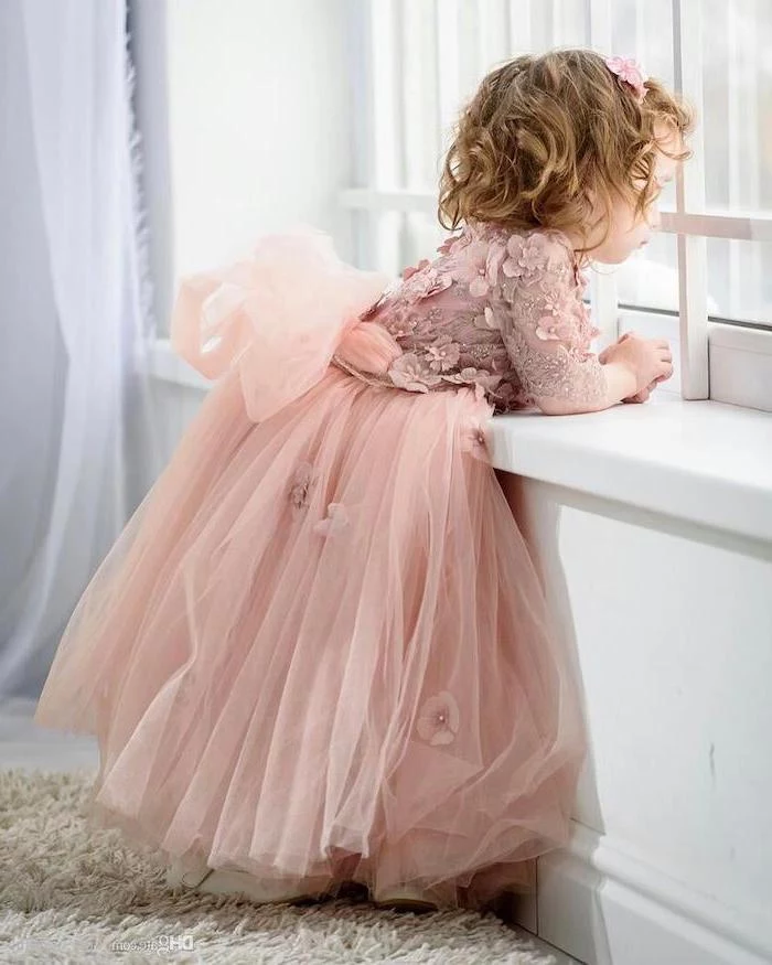 pink lace and tulle dress, little girl, looking out the window, flower girl dress, short blonde wavy hair