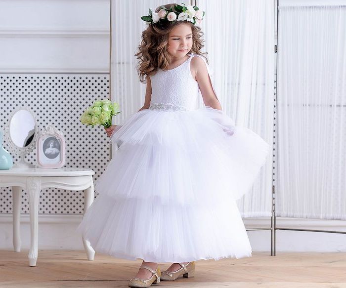 gold sequinned shoes, toddler girl dresses, brown wavy hair, white lace and tulle dress, wooden floor