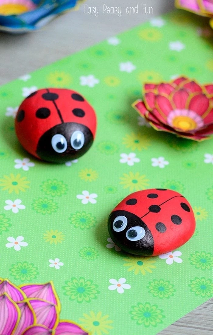 preschool games for kids, green paper, ladybugs made of rocks, with googly eyes