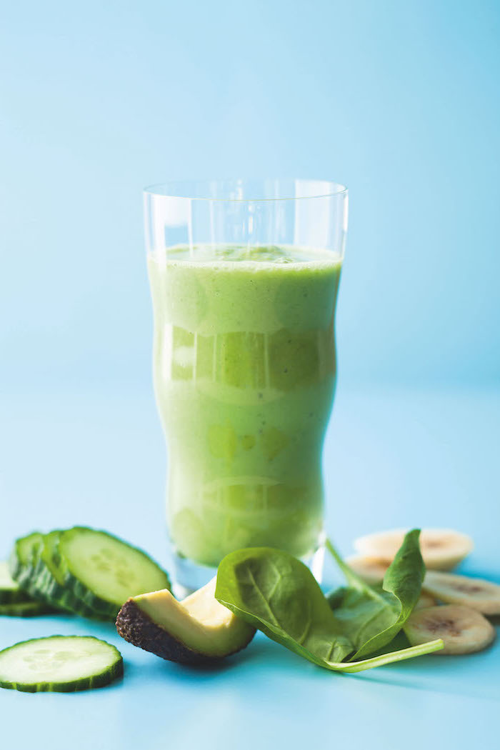 green smoothie, in a tall glass, breakfast smoothie recipes, cucumber and banana slices, avocado and spinach