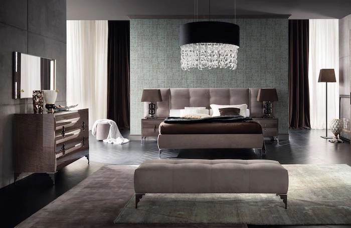 how to decorate a small bedroom, grey bed frame and ottoman, wooden floor, printed carpet