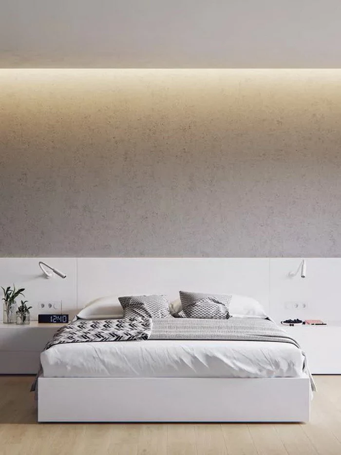 grey granite wall, bedroom design ideas, white bed, white shelves and drawers, wooden floor