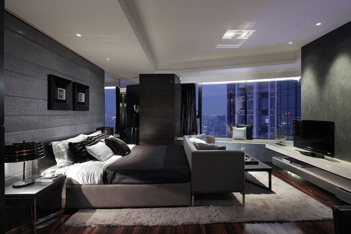 grey walls, wooden floor, grey bed frame and sofa, how to decorate a small bedroom, large windows