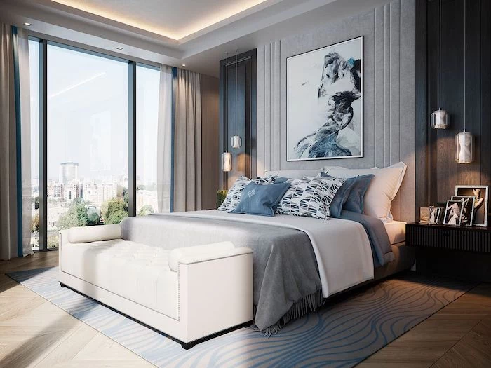 grey and blue walls and carpet, wooden floor, modern bedroom ideas, white leather ottoman