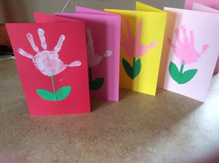 greeting cards, preschool learning activities, handprints on the front, pink and yellow paper