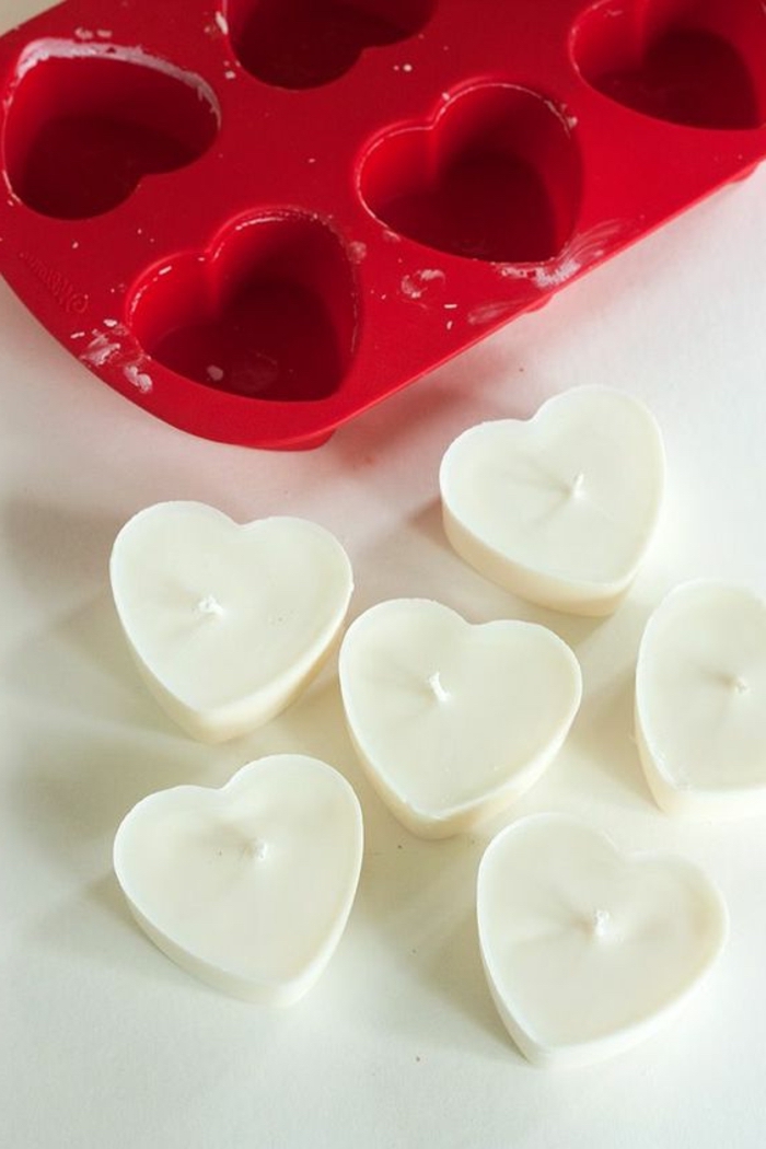 red ice tray, how to make your own candles, heart shaped candles, white countertop