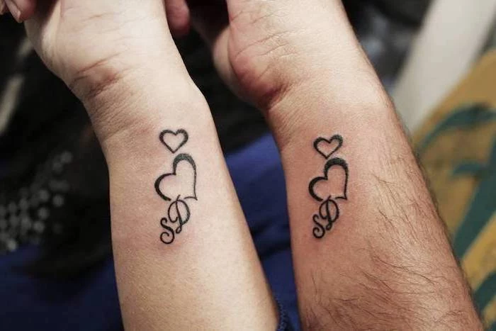 hearts and initials, wrist tattoos, matching tattoos for couples in love
