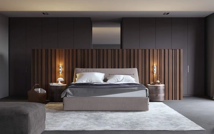 grey walls, wooden head boards, grey floor, white carpet, small master bedroom ideas, grey ottoman