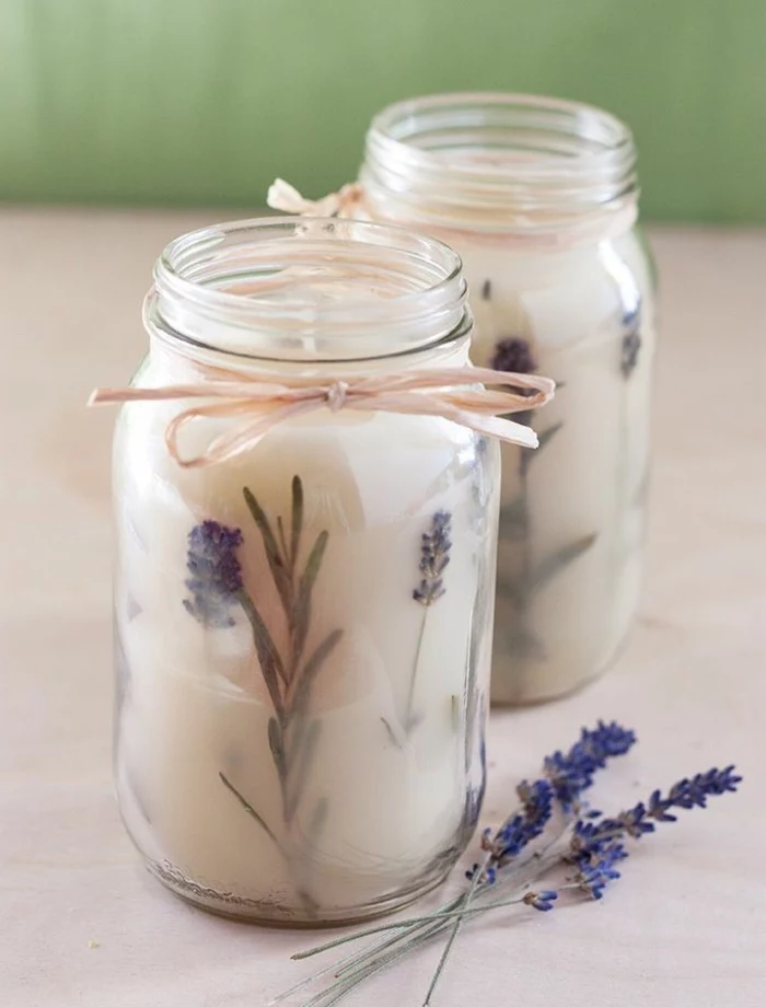 two large jars, filled with candle wax, mixed with lavender, diy candles