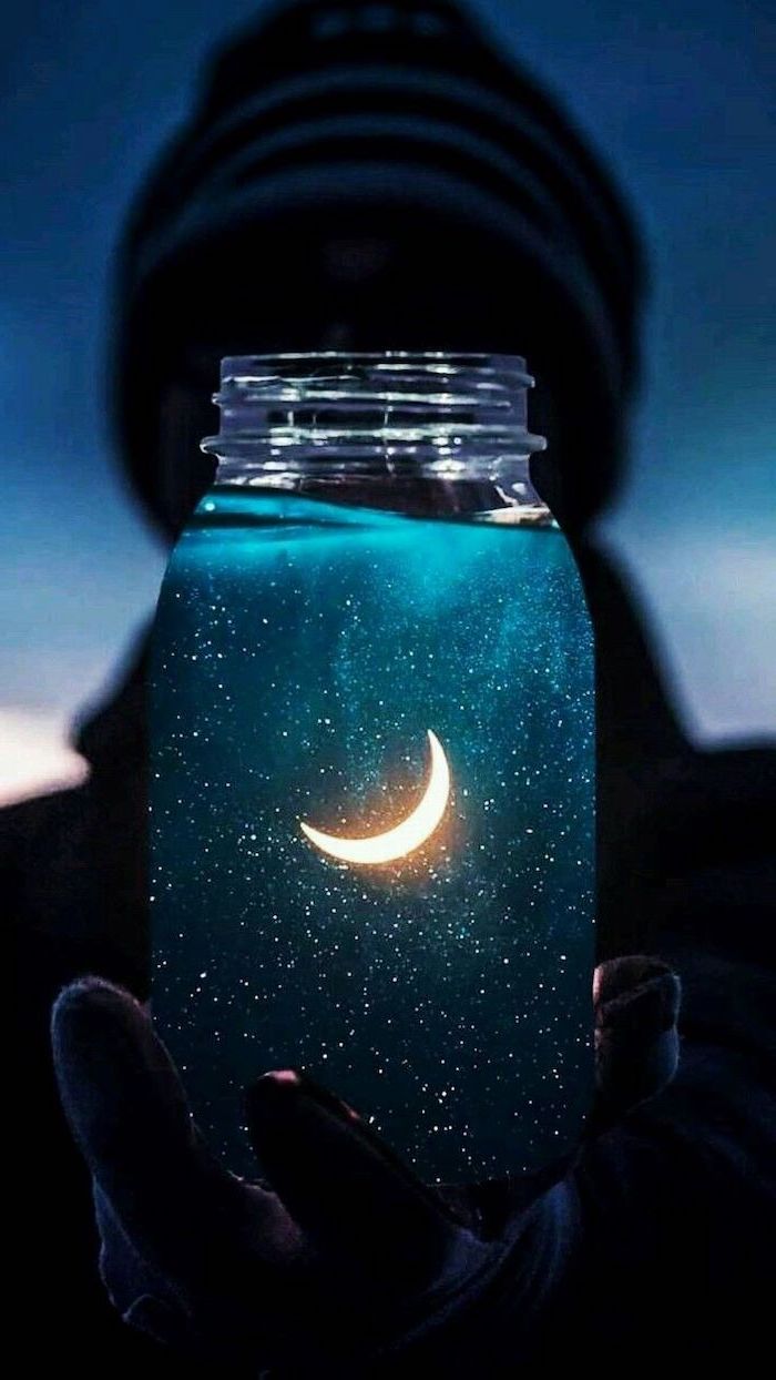 cute iphone backgrounds, person holding a jar, stars and moon inside