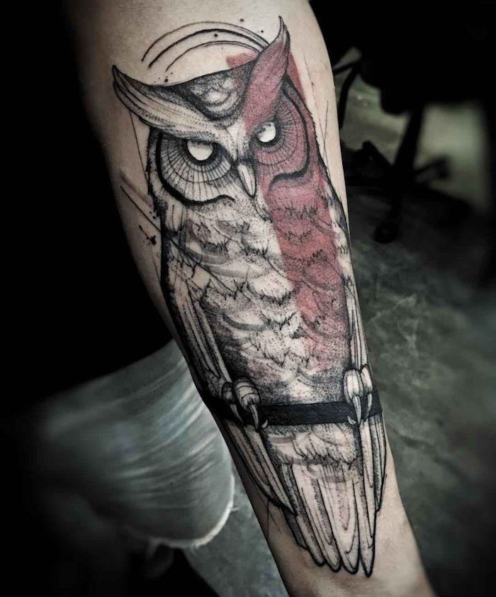 large owl, red line across it, simple tattoos for men, short jeans, black shirt
