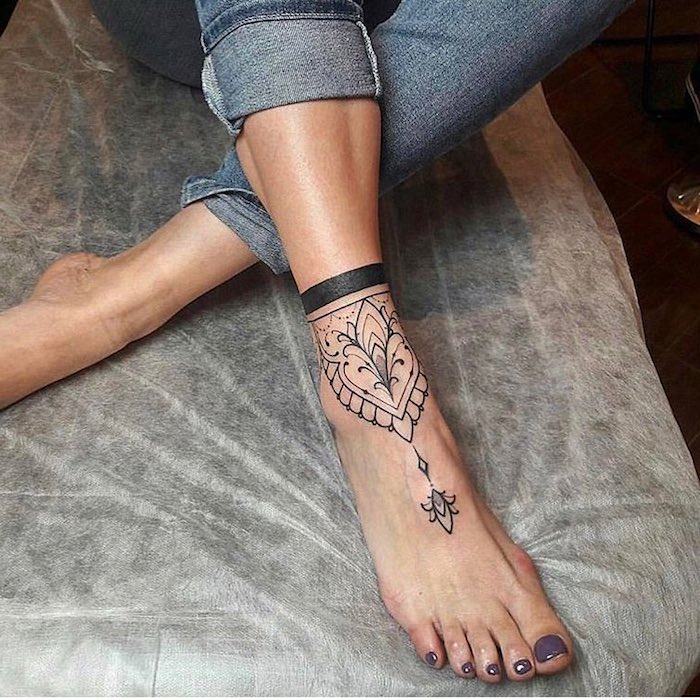 mandala ankle tattoo, purple nail polish, leg tattoos for women, white bed