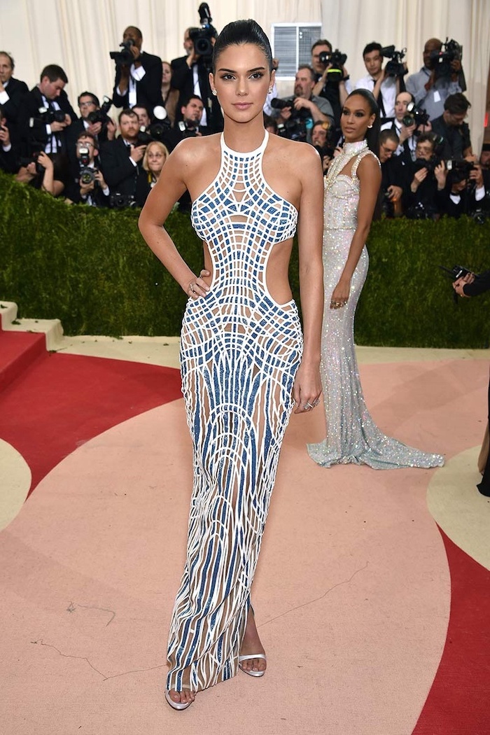 kendall jenner, wearing a long printed dress, in blue white and beige, met gala theme, silver sandals
