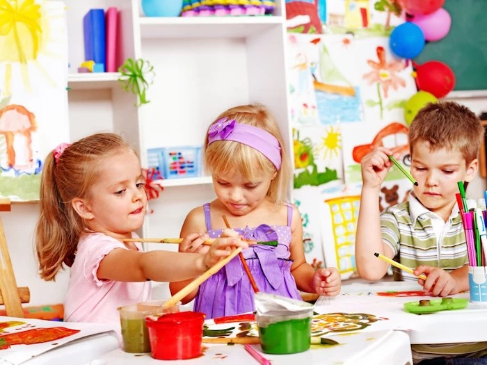 little kids, painting with paintbrushes, red and green paint, preschool activities, boy holding pencils
