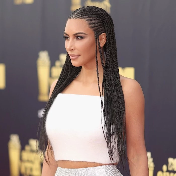 kim kardashian, wearing a white crop top, silver skirt, cornrow braid hairstyles, on black hair