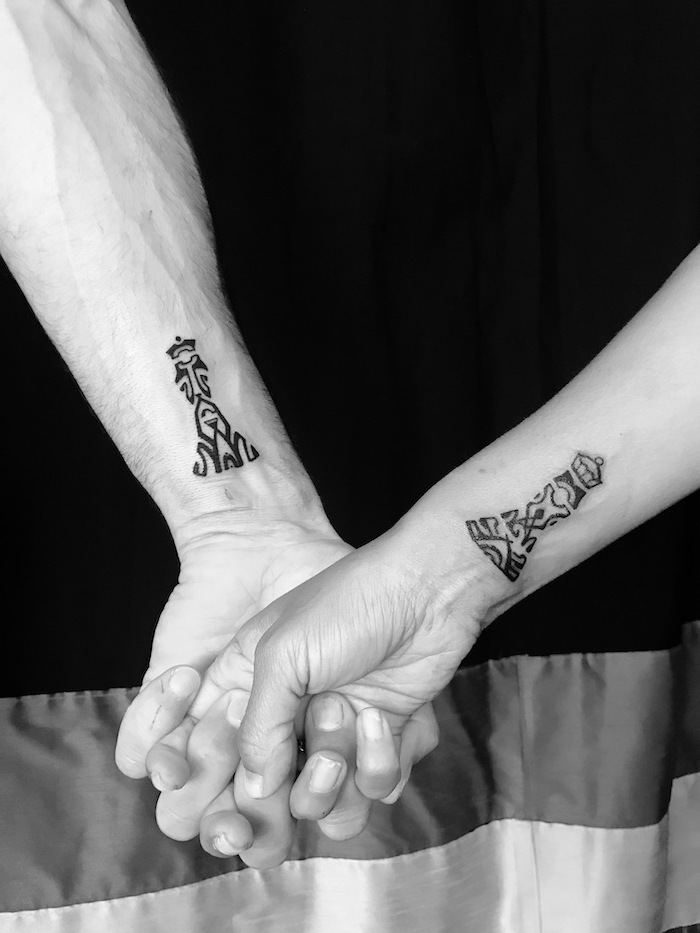 king and queen, chess pieces, wrist tattoos, couple tattoo ideas, holding hands
