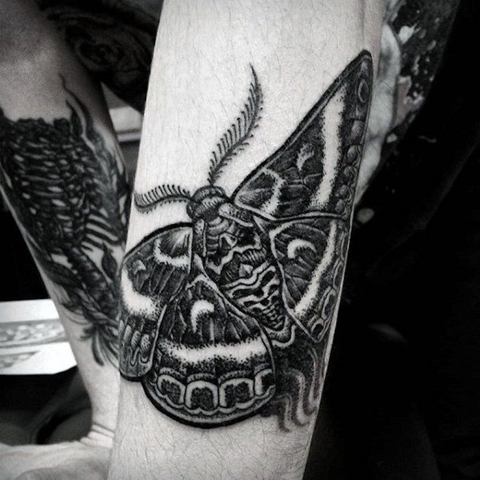 simple tattoos for men, large moth, black and white photo