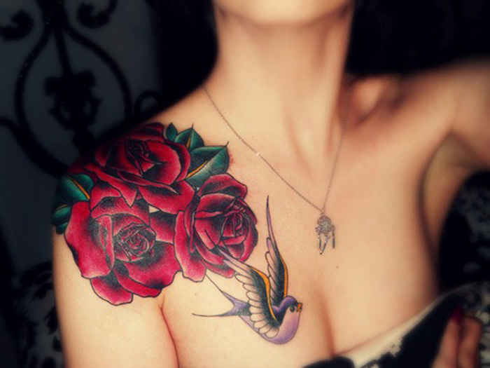 red roses, bird flying, shoulder tattoo, tattoo ideas with meaning