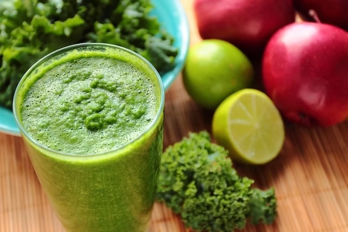limes and apples, cabbage in a blue bowl, protein smoothie recipes, on a wooden table