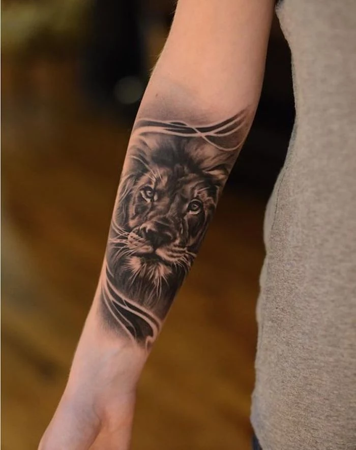 lion head, forearm tattoo, tattoo ideas with meaning, grey top