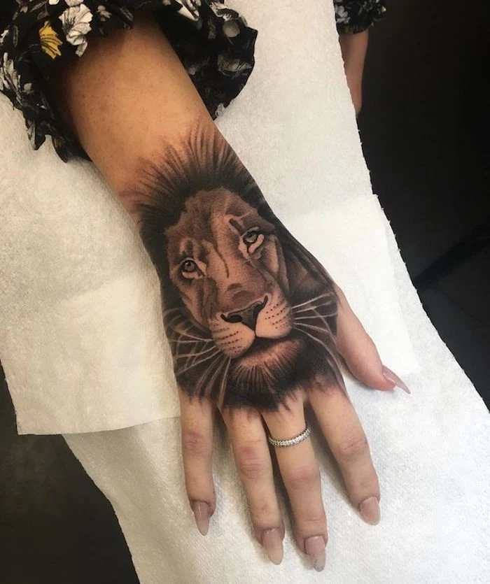 lion head, arm tattoo, feminine tattoos, white paper, diamond ring, long nails