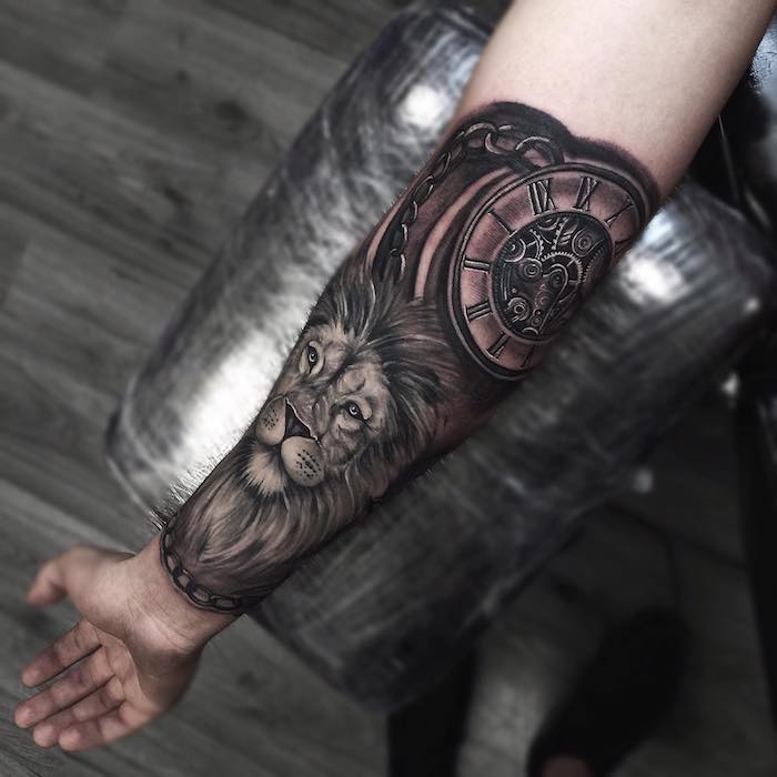 Winged Harley Shield And Skull Tattoo On Forearm