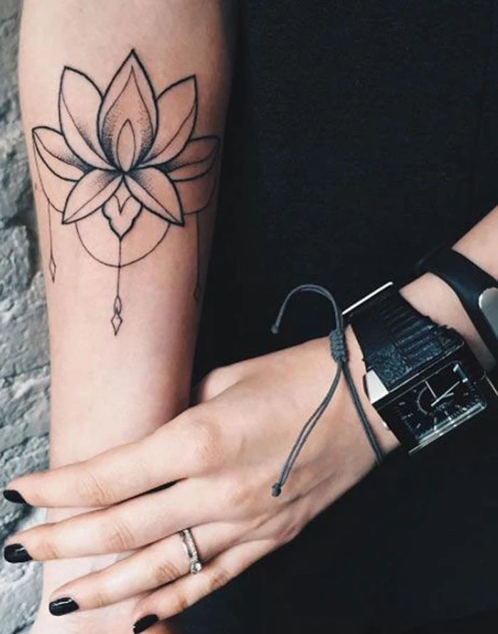 black watch and bracelets, black nail polish, feminine tattoos, lotus flower, forearm tattoo