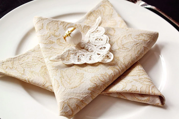 luxury wedding napkins, white lace with pearls on top, how to fold napkins, white plate