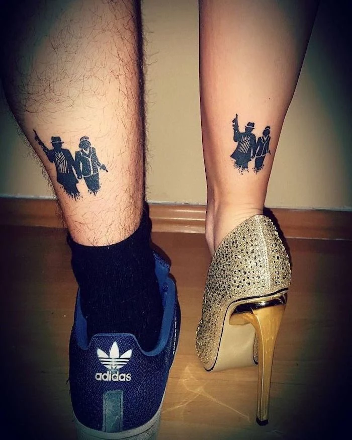 man and woman with weapons, unique couple tattoos, back of leg tattoos, gold high heels, adidas sneakers