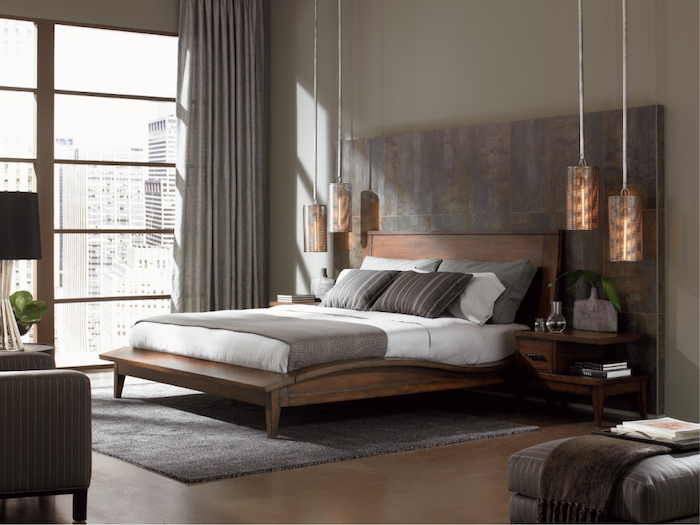 tiled accent wall, wooden bed, hanging lamps, how to decorate a bedroom, grey carpet, tall windows