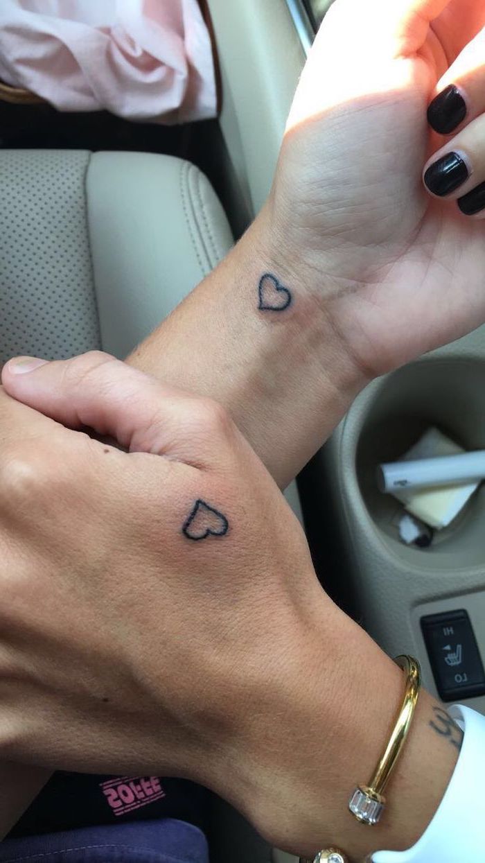 boyfriend and girlfriend tattoos, hearts hand and wrist tattoos, black nail polish
