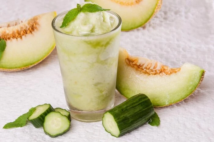 sliced melon and cucumber, smoothie recipes with frozen fruit, tall glass, mint on top