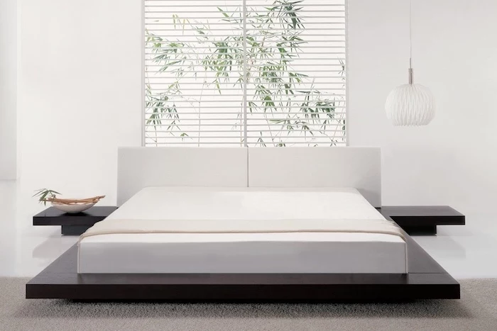 white blinds, over the bed decor, black wooden bed frame, white leather headboard, white walls