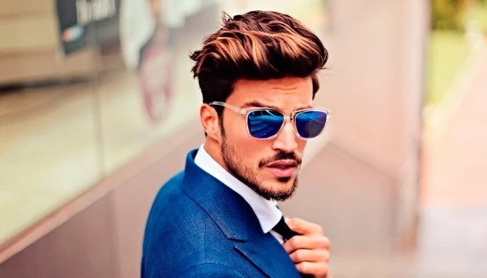 blue jacket, brown hair, medium hairstyles for men, white shirt, black tie, man wearing sunglasses